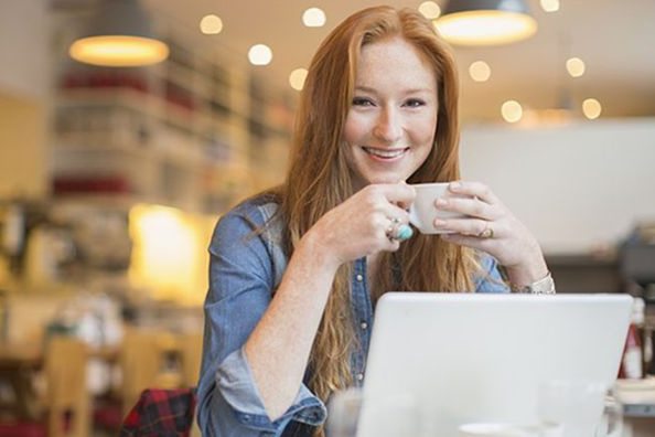 woman in cafe on laptop