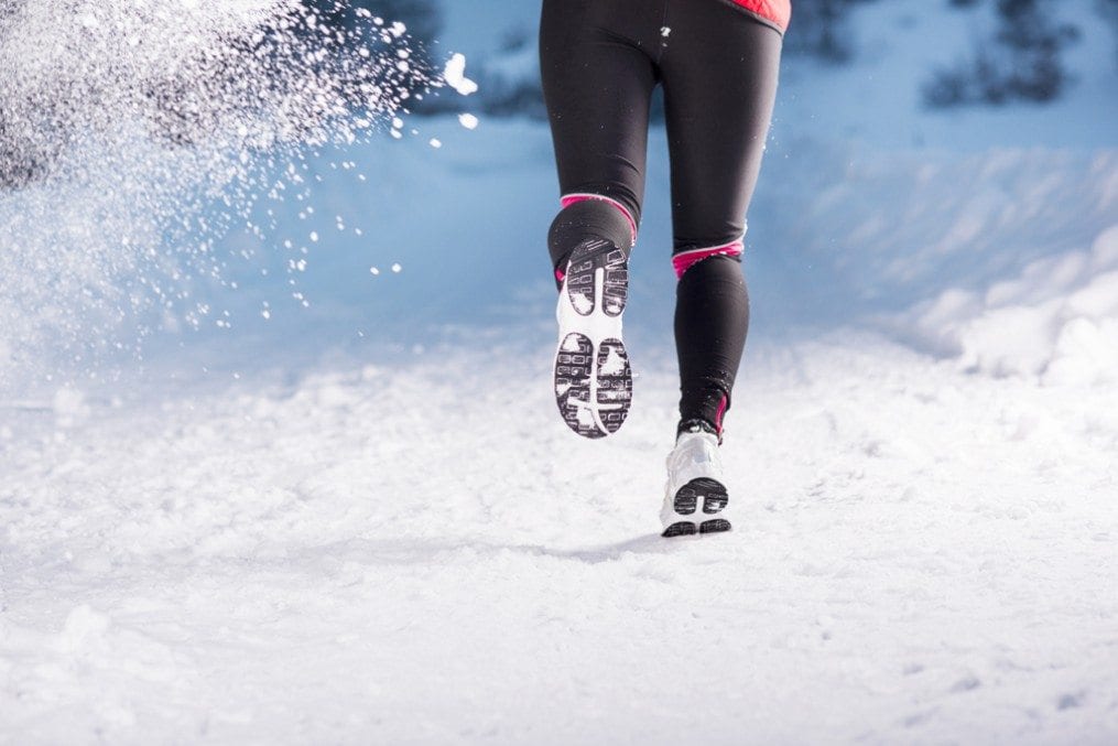 Woman doing HIIT in snow