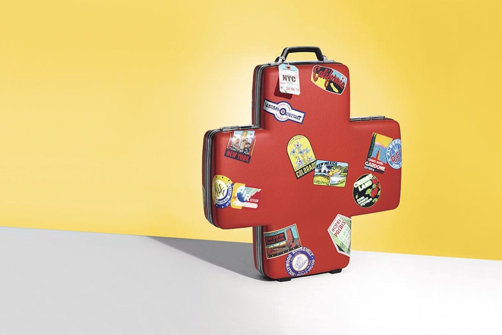 Suitcase shaped like a first aid symbol