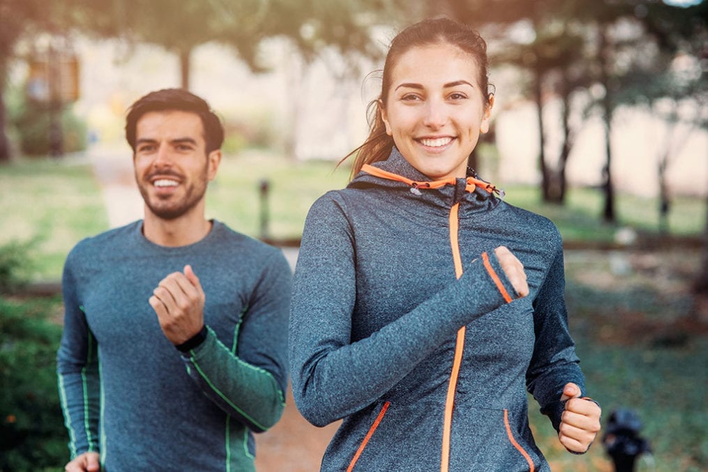 Active Iron - man and woman jogging