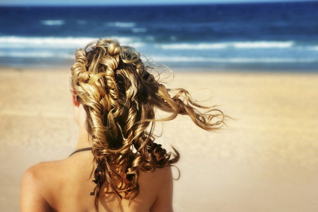 woman with lovely hair on beach